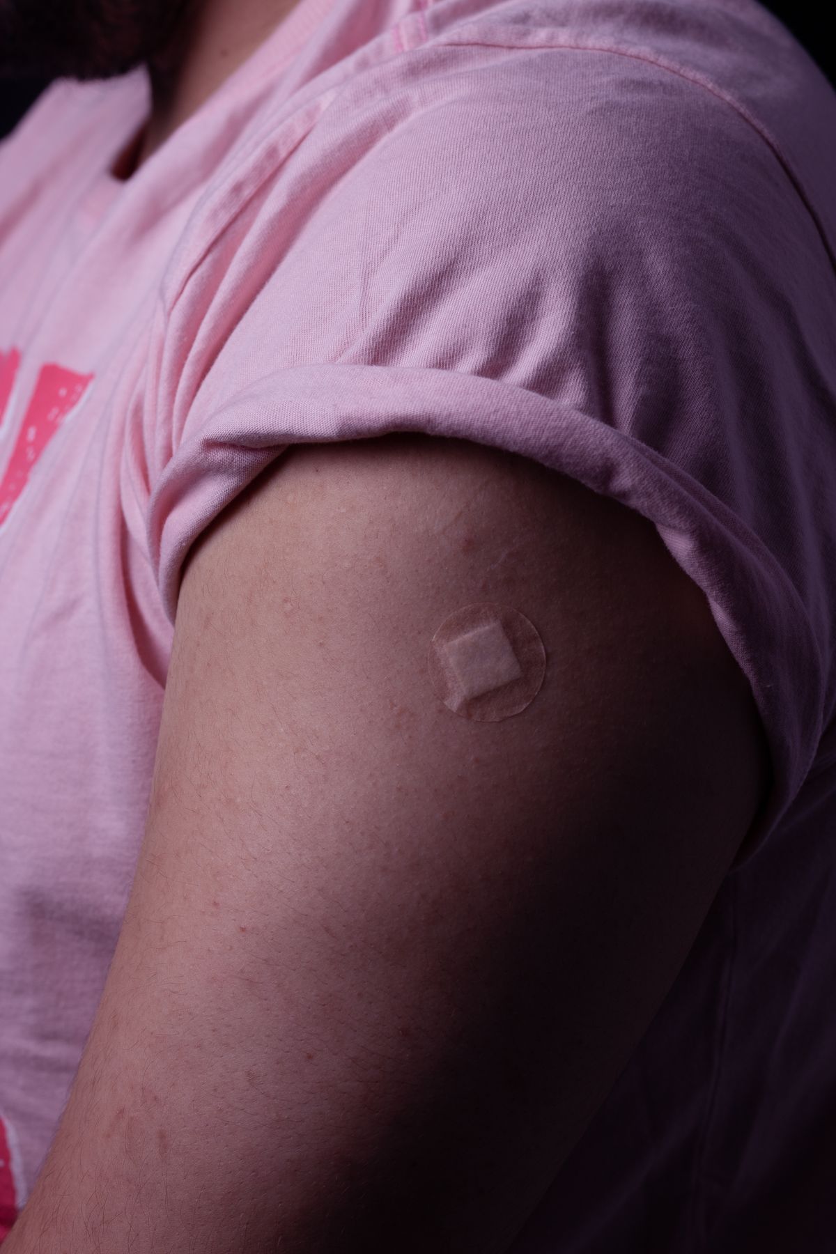 A bandage on an upper arm