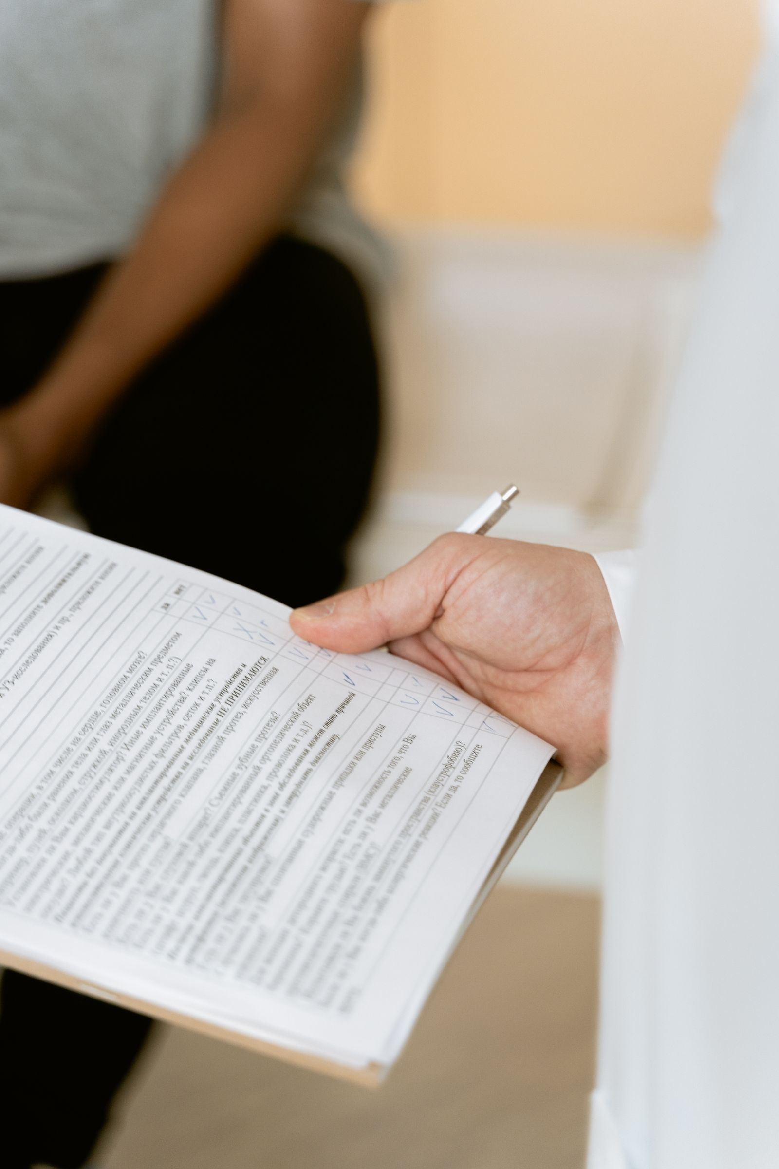 A clinician reviewing a form