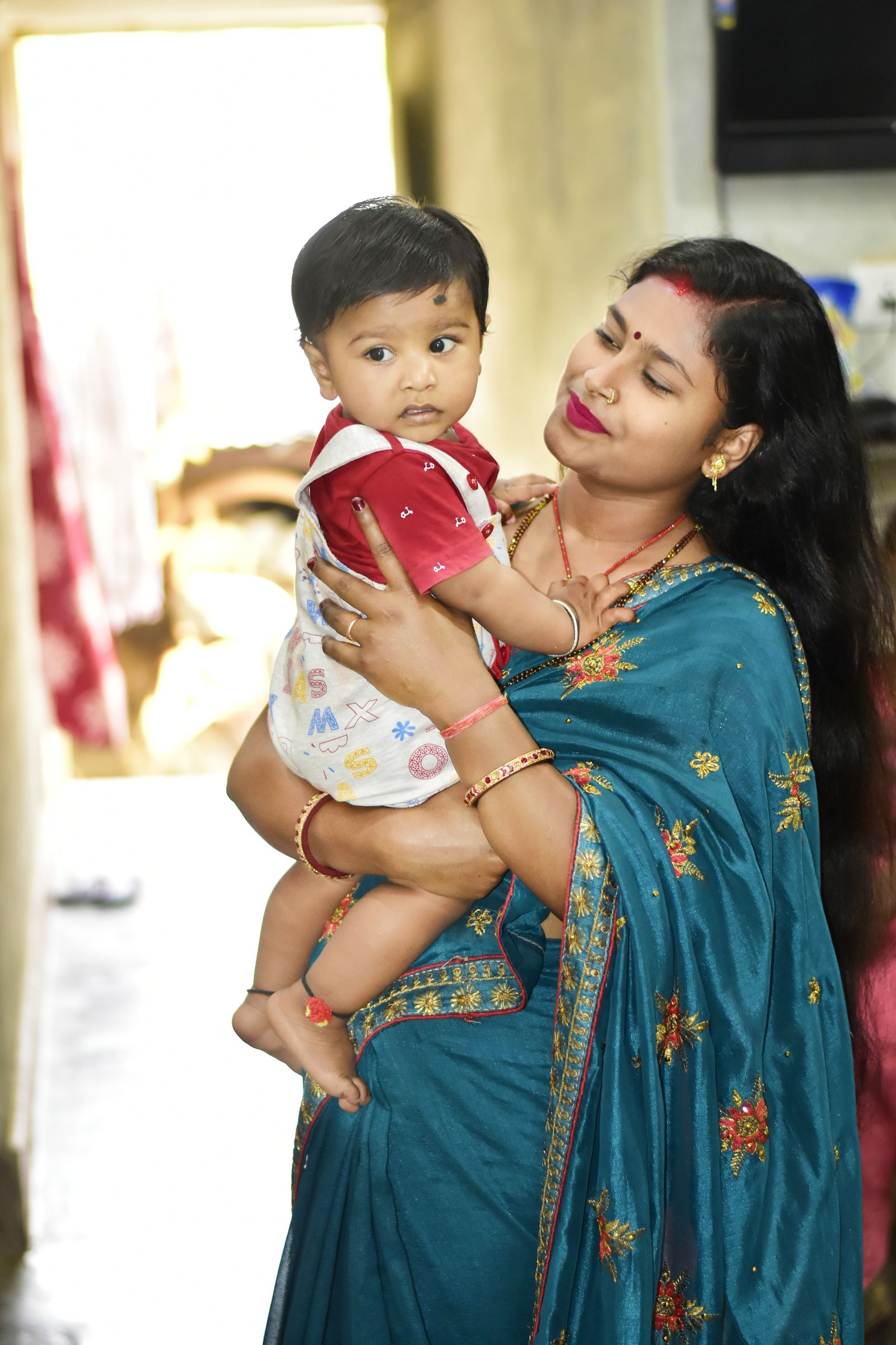A mother holding her baby